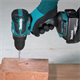 Perceuse-visseuse à percussion Makita DHP490RTJ 2x5.0Ah